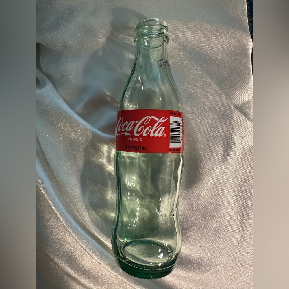 Coca-Cola Classic Glass Bottle with Red Label and Green-Tinted Glass